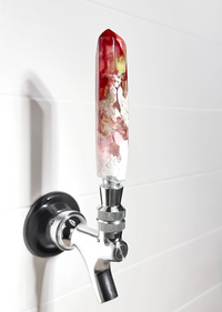 Handmade red, gold, pink, and white resin beer tap handle in a crystal shape