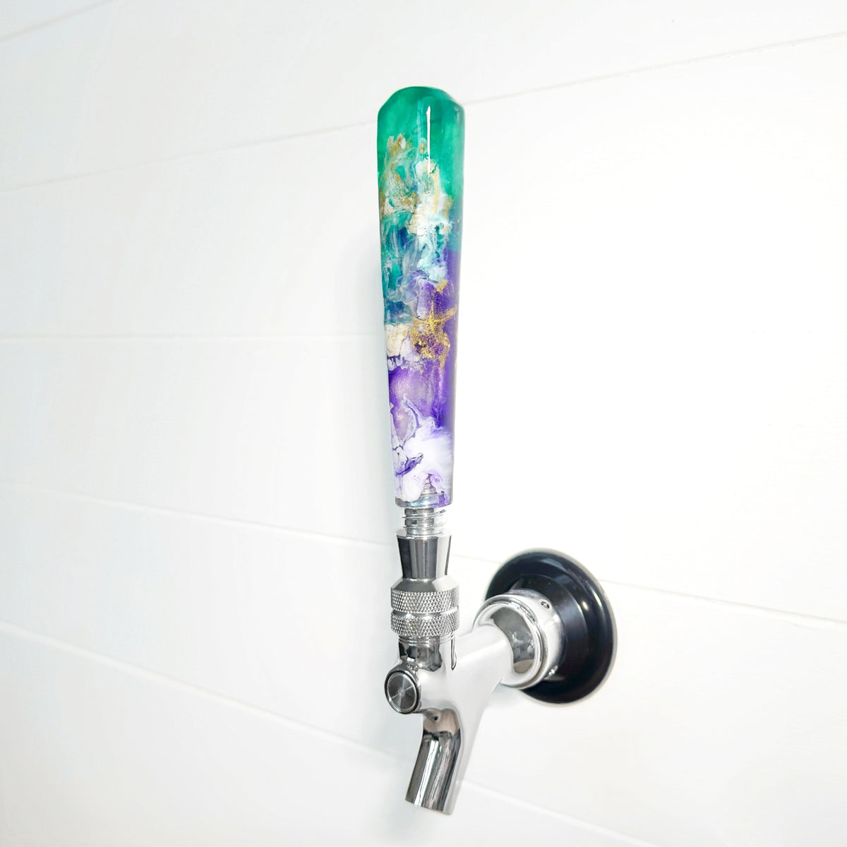 Decorative beer tap handle in green and purple marble design