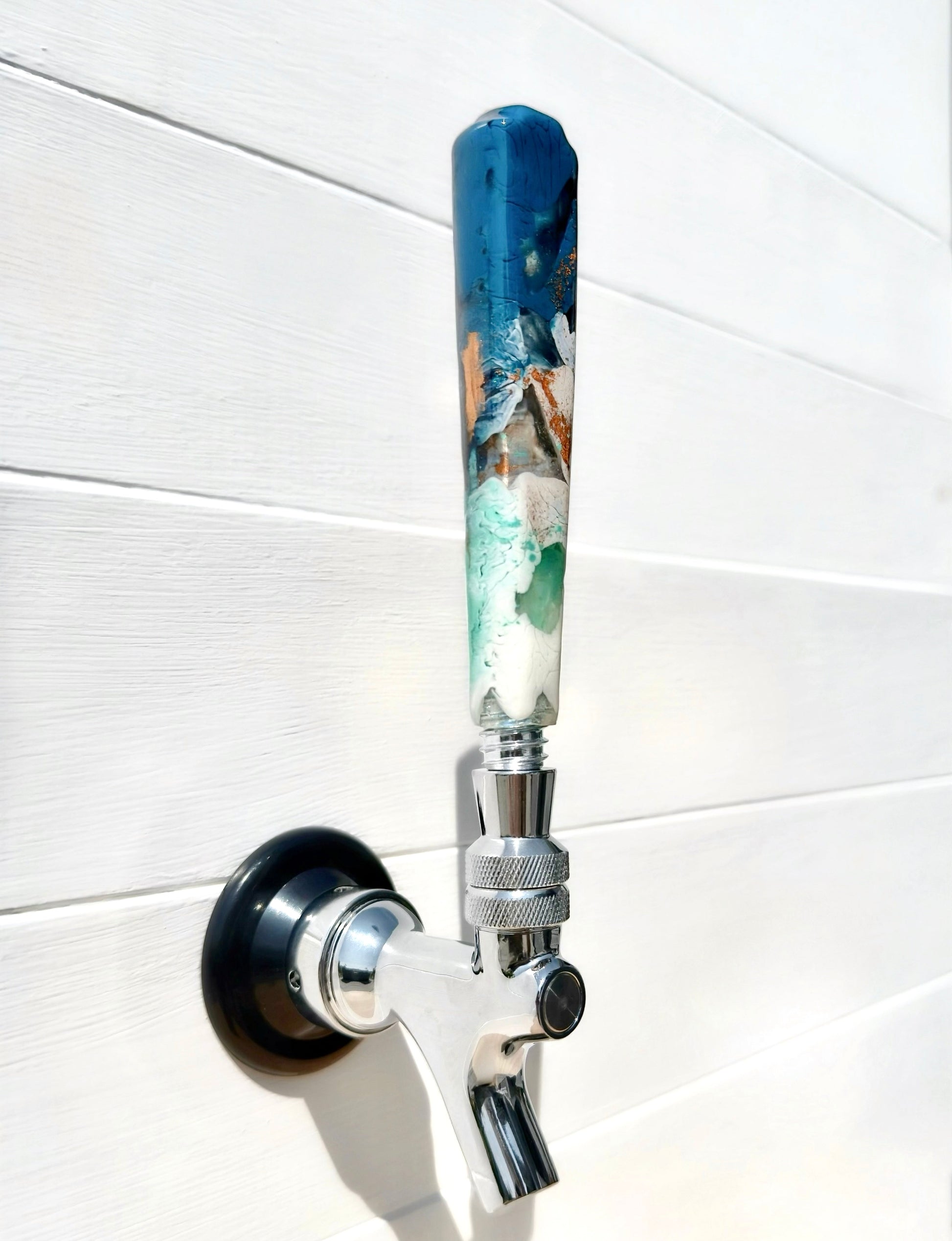 Handmade resin beer tap handle in deep teal, mint, white, and earthy bronze