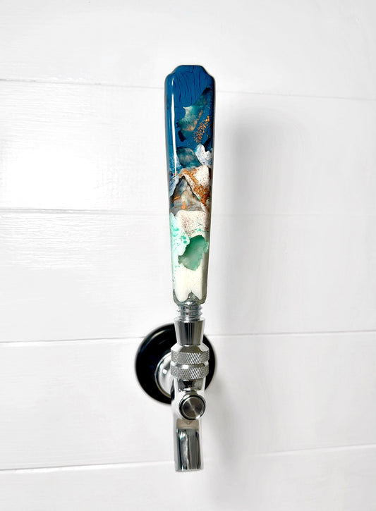 Handmade resin beer tap handle in deep teal, mint, white, and earthy bronze