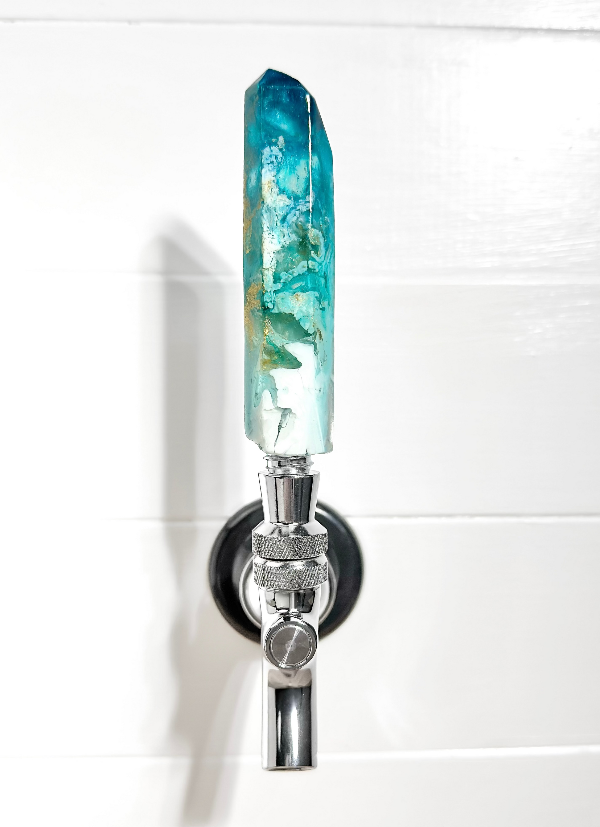 Handmade turquoise, teal, white, and gold resin beer tap handle in a crystal shape